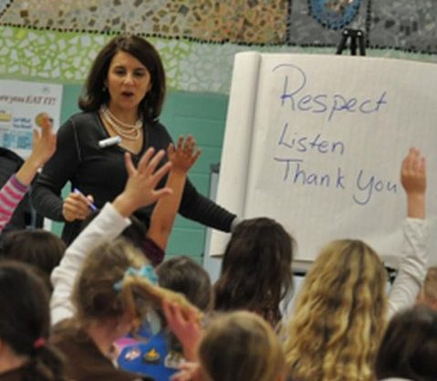 Lisa Richey teaching etiquette at a school event